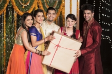 couples with a huge diwali present 