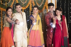 couple celebrating diwali with sparklers 