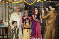 family clicking pictures on diwali 