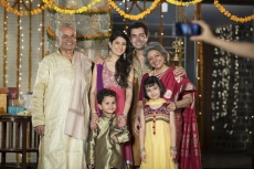 family clicking pictures on diwali 