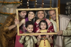 traditional indian famil in a picture frame