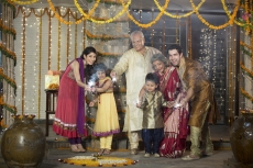 family celebrating diwali with crackers 