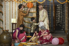 family decorating home on diwali 