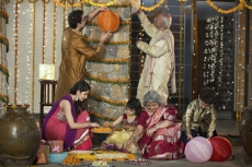 family decorating home on diwali 