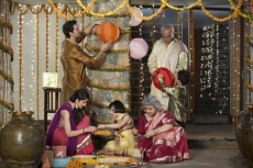 family decorating home on diwali 