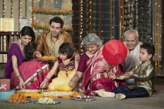 family celebrating diwali and doing pooja