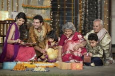 family celebrating diwali and doing pooja
