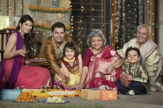 family celebrating diwali and doing pooja
