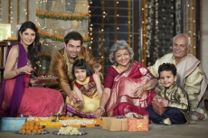 family celebrating diwali and doing pooja
