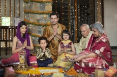 whole family sitting for diwali pooja