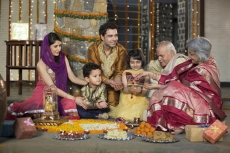 whole family sitting for diwali pooja