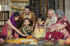 whole family sitting for diwali pooja