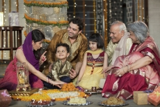 whole family sitting for diwali pooja