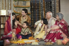 whole family sitting for diwali pooja