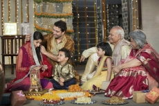whole family sitting for diwali pooja