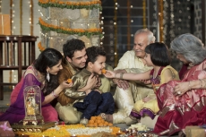  family celebrating diwali together 