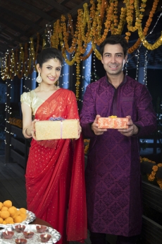 diwali couple holding presents