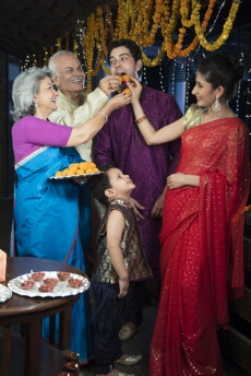 traditional family celebrating diwali
