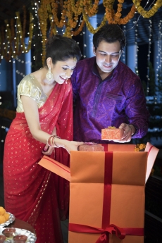 couple opening presents on a festival