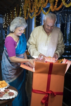 happy old couple enjoying the festival of diwali