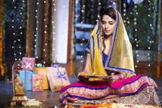woman doing diwali pooja at home