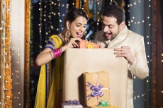 couple opening diwali presents 