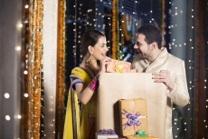 couple opening diwali presents 