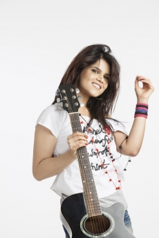 young beautiful woman with an acoustic guitar