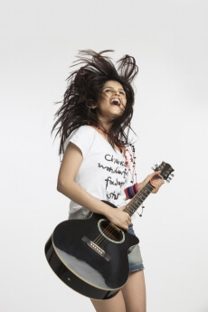 young beautiful woman with an acoustic guitar