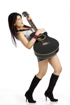 teenager in cool casual clothing with a guitar