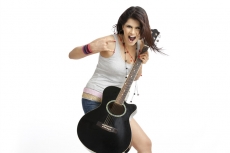 teenager in cool casual clothing with a guitar