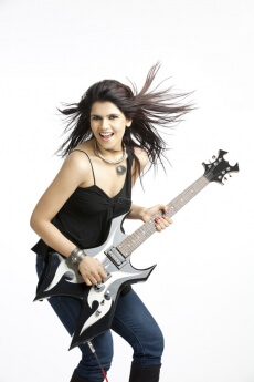 beautiful young female with electric guitar on white background