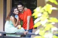 couple drinking coffee at balcony
