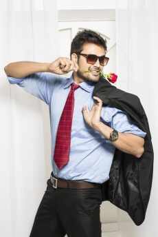 man with rose in his mouth 