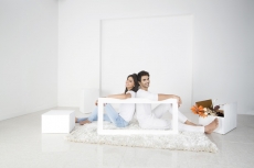 couple posing with frame