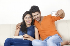 boy taking selfie with girl 
