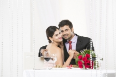 couple on dinner date posing for the camera