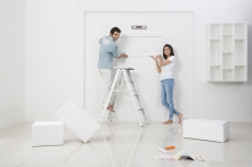 newly wed couple decorating their new home