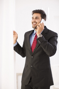 man in formals talking on phone