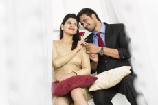 man giving rose to girl 