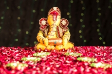 lord ganesha idol with diyas 