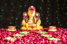 lord ganesha idol with diyas