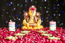 lord ganesha idol with diyas 