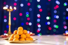 lighting lamps and ladoo on diwali 