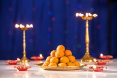 lighting lamps and ladoo on diwali 