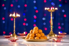lighting lamps and ladoo on diwali 