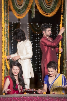 couples decorating home on diwali 