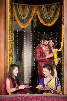 couples decorating home on diwali 
