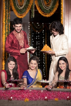 couples decorating home on diwali 
