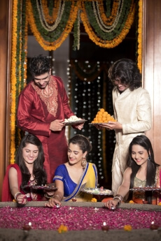 couples decorating home on diwali 